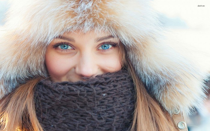 Portrait of Woman in Fluffy Winter Hat and Scarf
