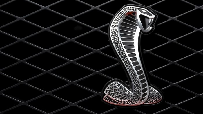 Ford Mustang Shelby Cobra emblem on a black grille