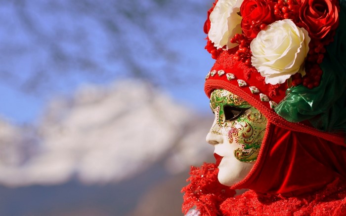 Venetian mask with flowers and red costume