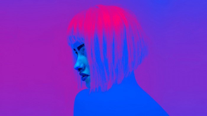 Woman with pink and blue hair and nose ring