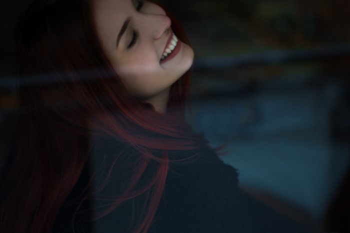 Woman with red hair smiling