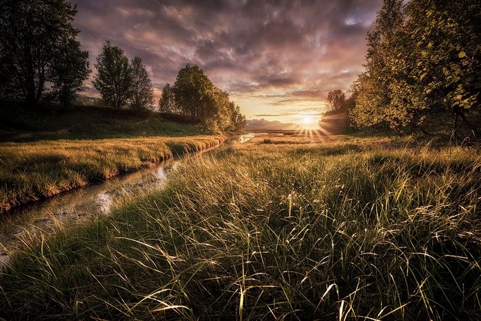 Sunset over a Serene River Meadow in Norway