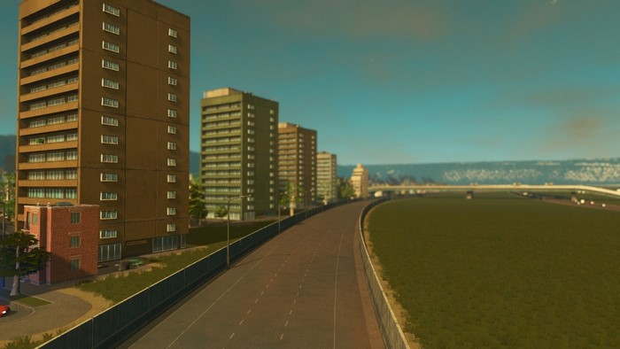 Cities Skylines cityscape with apartment buildings and highway