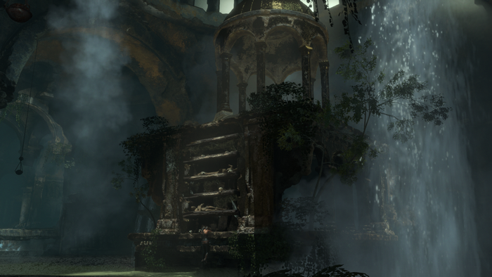 Lara Croft in a ruined temple with a waterfall