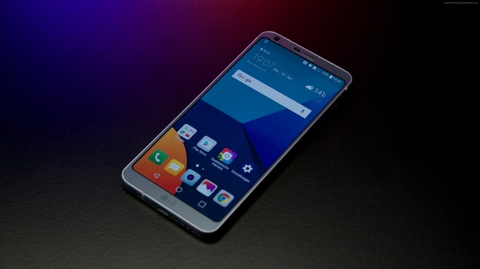 LG G6 Mini smartphone on a dark surface