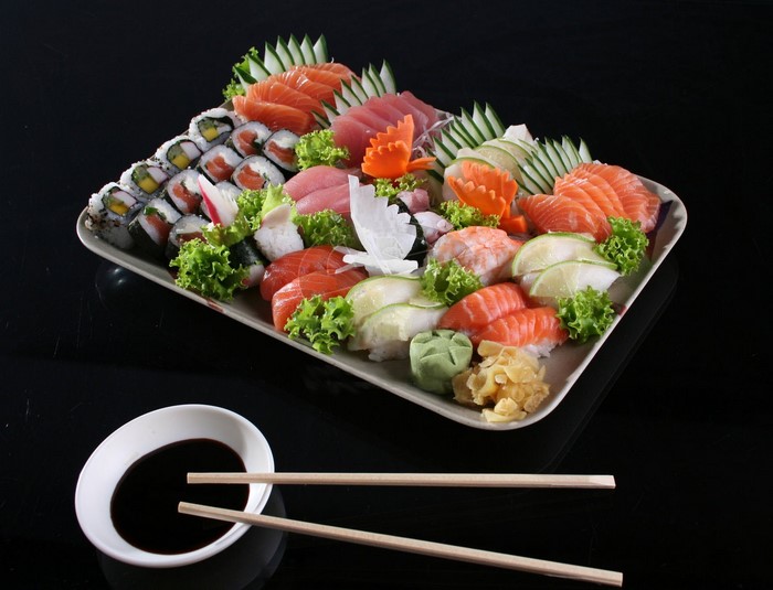 Sushi and Sashimi Platter with Soy Sauce and Chopsticks