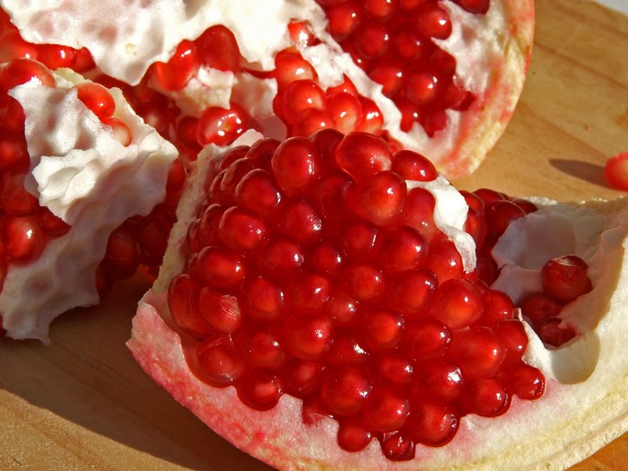 Close-up of a cut pomegranate with seeds