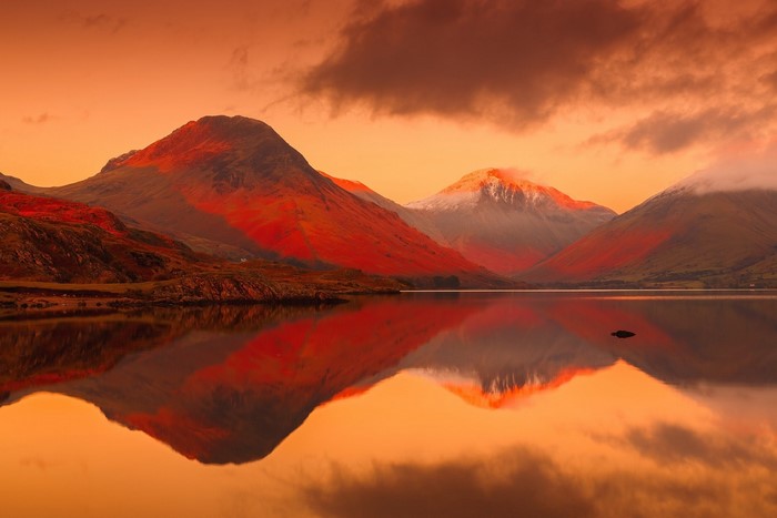 Mountains reflecting in a lake at sunset