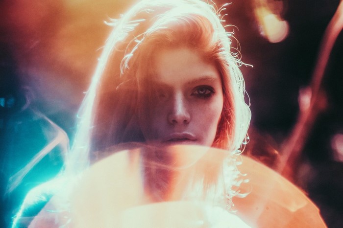Woman with red hair and dramatic lighting