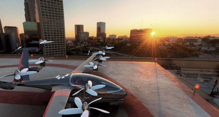 Joby S2 aerial vehicle on a helipad at sunset
