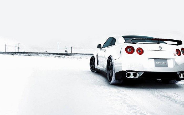 White Nissan GT-R R35 on a snowy road