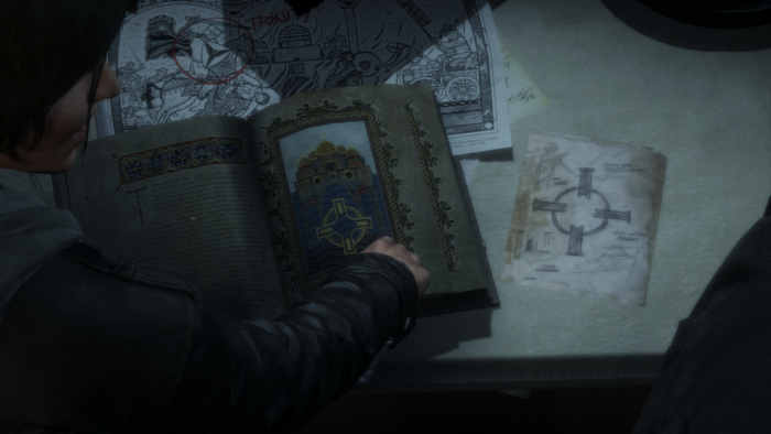 Lara Croft studying a book in Rise of the Tomb Raider