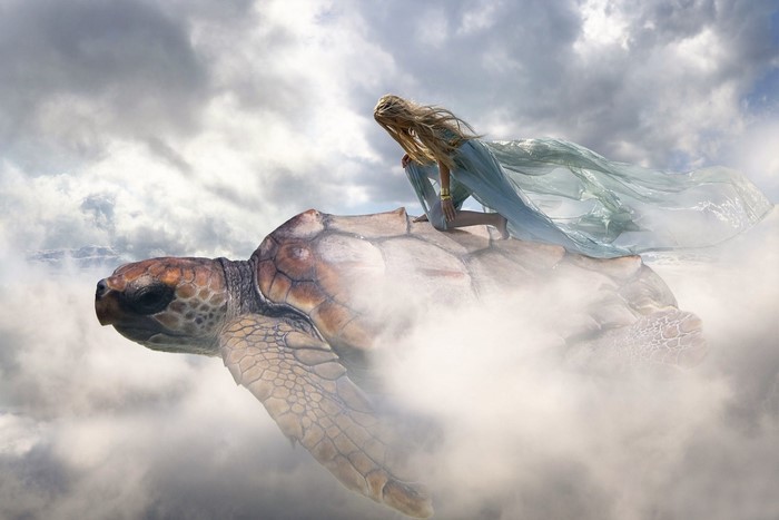 Woman riding a sea turtle through clouds