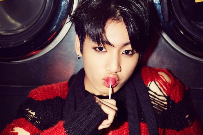 Jungkook from BTS with a lollipop