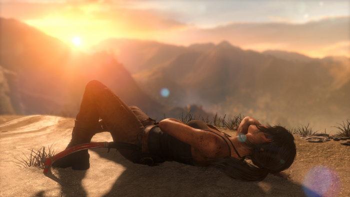 Lara Croft from Tomb Raider lying down at sunrise