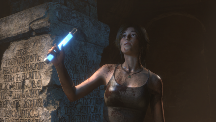 Lara Croft from Tomb Raider holding a glowing artifact