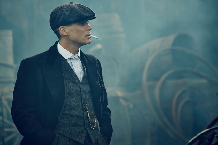 Peaky Blinders Character in Vintage Attire Smoking