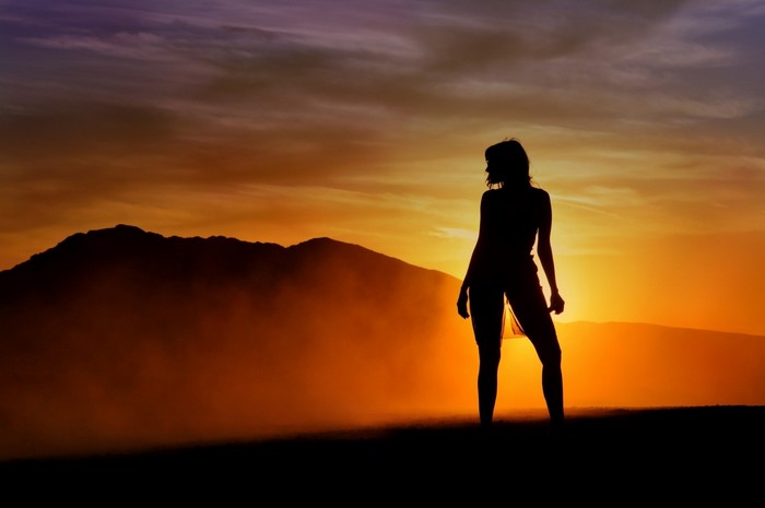 Silhouette of a woman at sunset