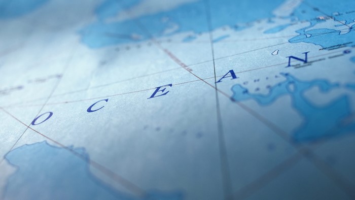 Close-up of a world map showing the word OCEAN