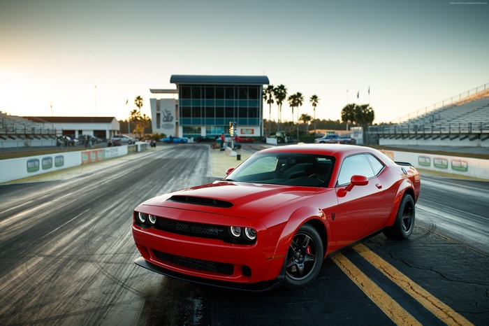 Red Dodge Challenger SRT Demon on a drag strip