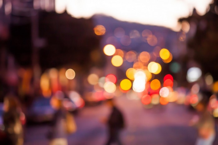 Blurred city lights at dusk with bokeh effect