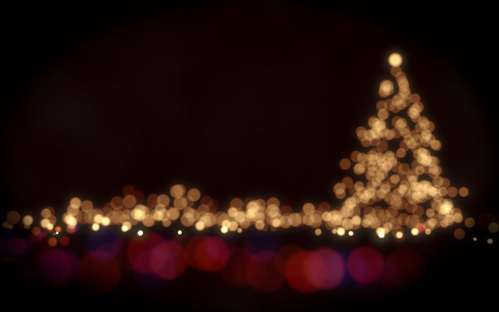 Blurred Christmas tree and lights at night