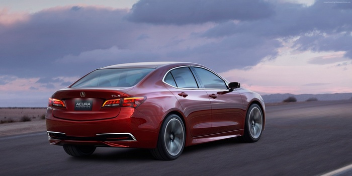 Red Acura TLX Prototype driving on a road