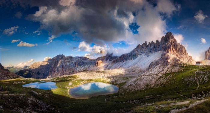 Mountain landscape with lakes and cabin in the Dolomites