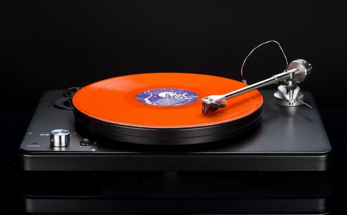 Turntable with orange vinyl record