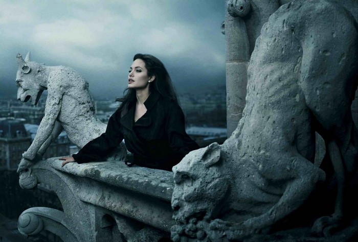 Angelina Jolie on a gargoyle-adorned rooftop