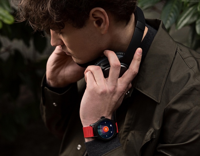Man wearing Montblanc Summit smartwatch and headphones