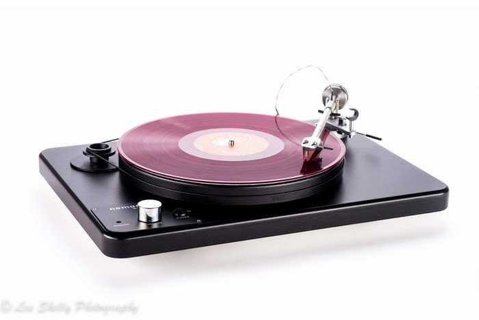 Black turntable with red vinyl record