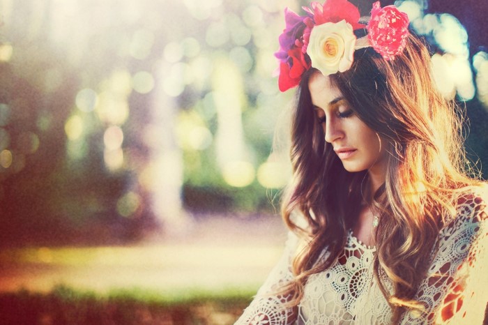 Woman with flower crown in sunlight