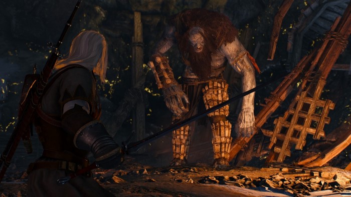 Geralt of Rivia fighting a giant in The Witcher 3: Wild Hunt