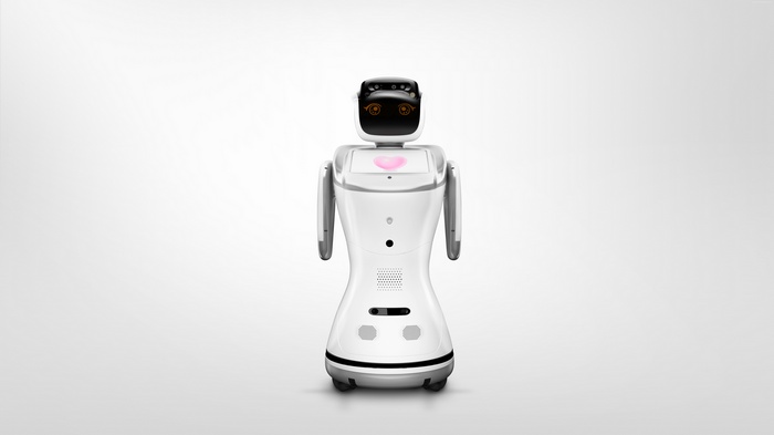 White Sanbot service robot with screen displaying a heart