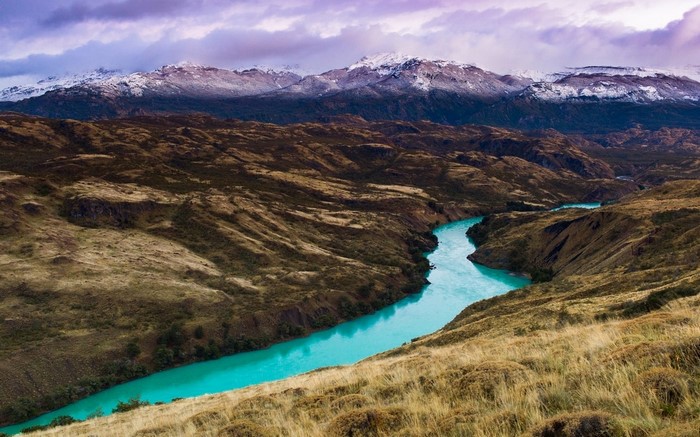 Turquoise River Winding Through Patagonian Mountains
