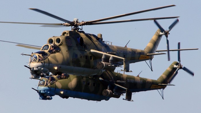Two Mil Mi-24 Hind helicopters in flight