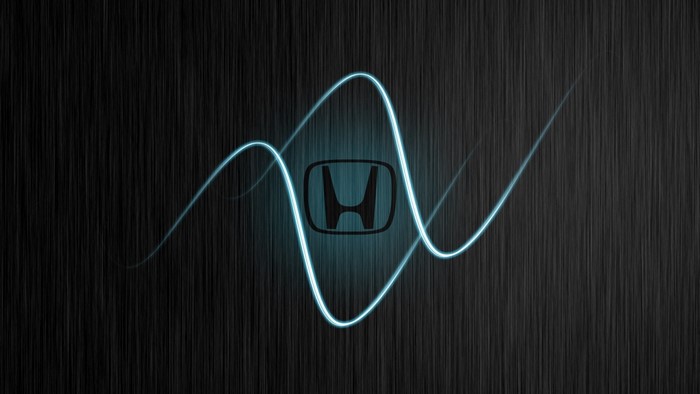 Honda logo with blue light streaks on a dark background