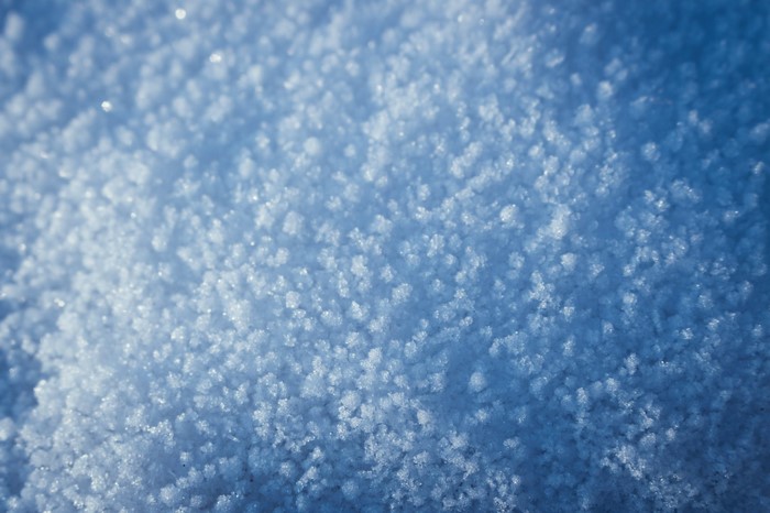 Close-up of snow crystals in sunlight