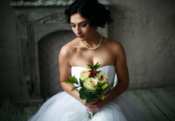 Bride in a white dress holding a bouquet