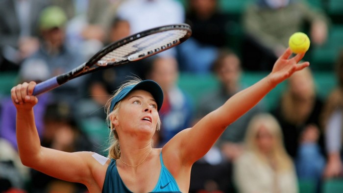 Maria Sharapova serving a tennis ball