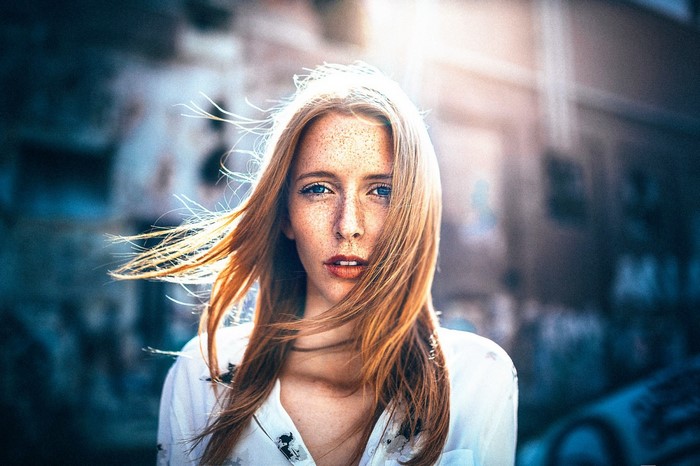 Woman with red hair and freckles in portrait
