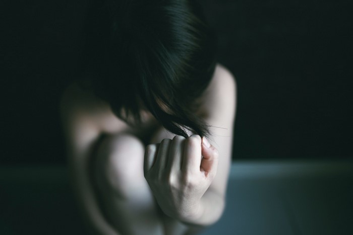 Close up of a woman's head and hands