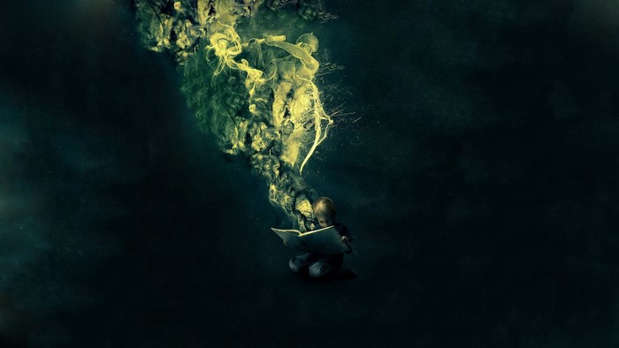 Child reading a book with smoke figures emerging