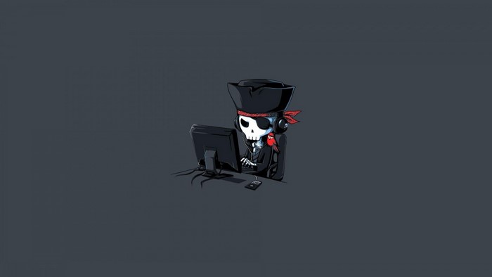 Skeleton pirate at computer