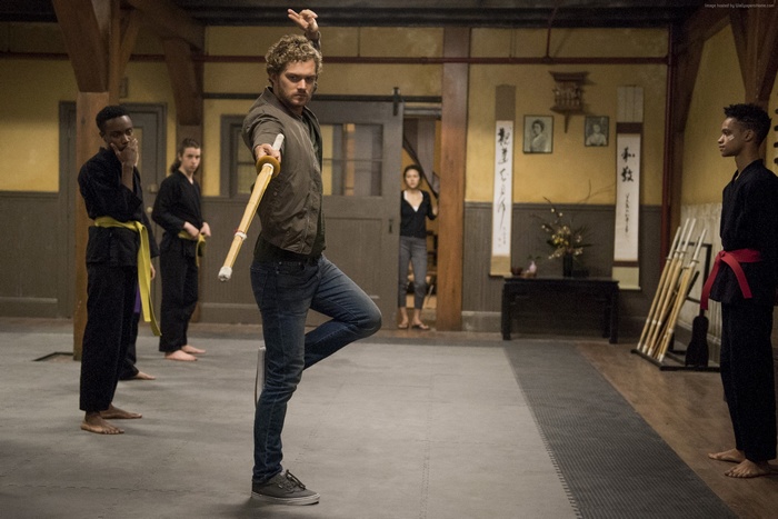 Iron Fist training with students in a dojo