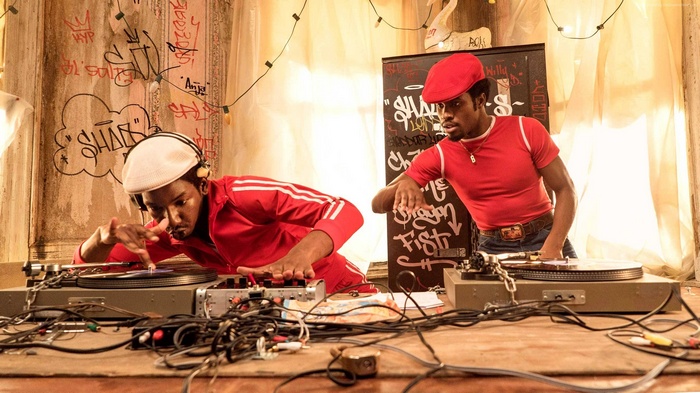 Two DJs performing at a party
