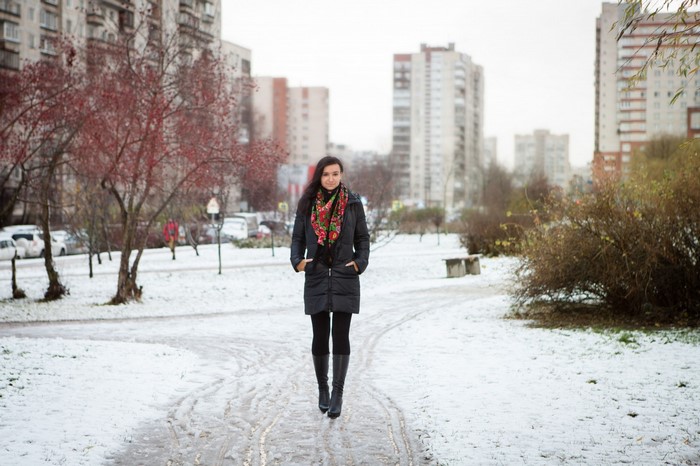 Woman in winter coat walking in snow