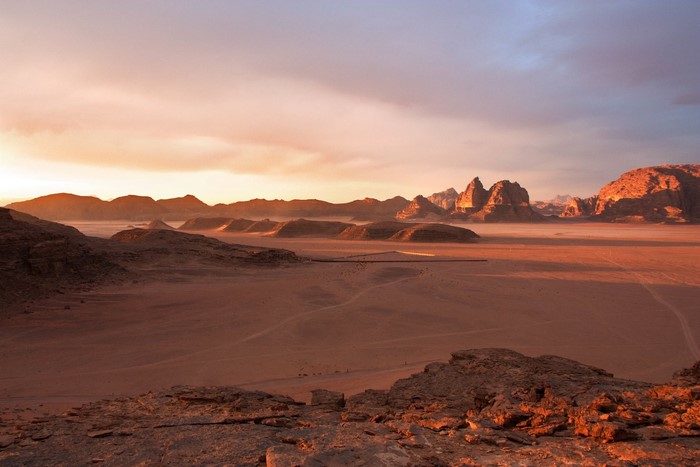 Desert landscape at sunset with mountains