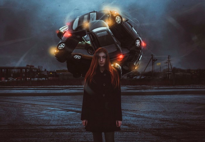 Woman in front of a vortex of cars